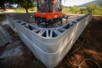 A close view of the precision-layered concrete walls of Kentucky’s first 3D-printed home reveals the internal geometry designed to reinforce the structure against extreme weather, including tornadoes and floods.